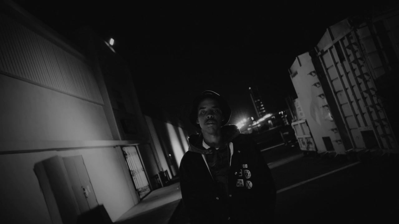 a person standing on a street at night