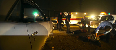 a group of men standing next to a white truck