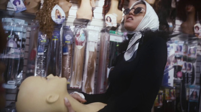 a woman wearing a headscarf in a store