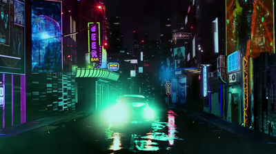 a car driving down a city street at night