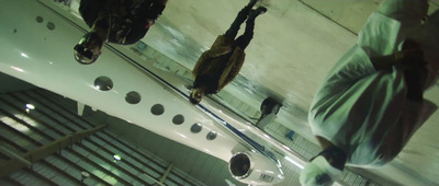 a group of mannequins hanging from a ceiling