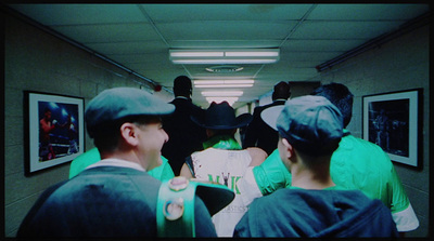 a group of people standing in a hallway