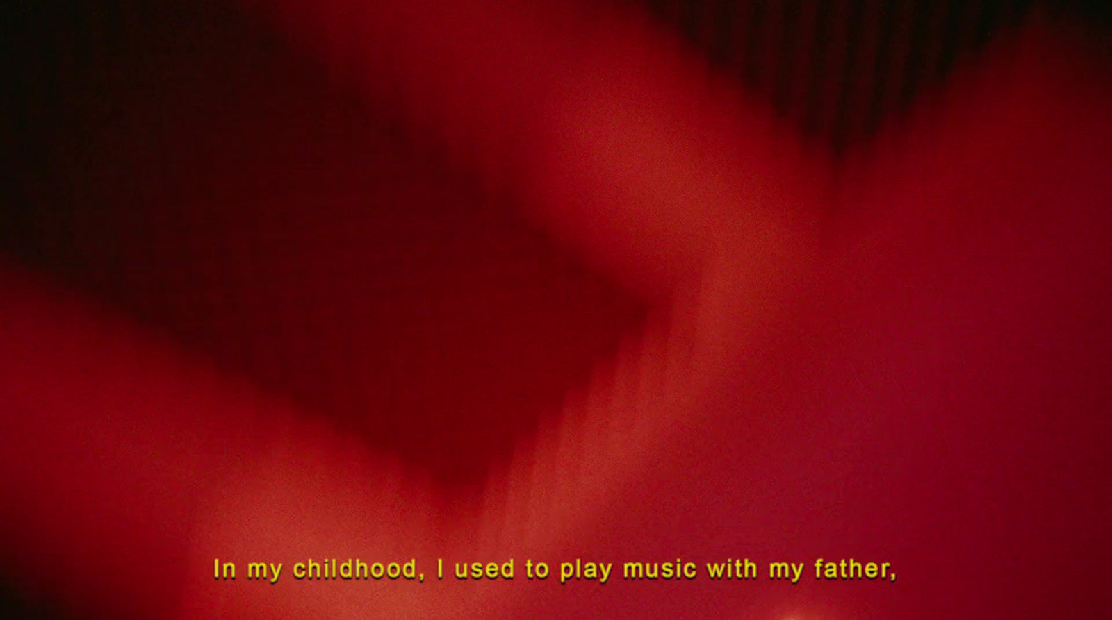 a blurry photo of a red background with the words in my childhood i used