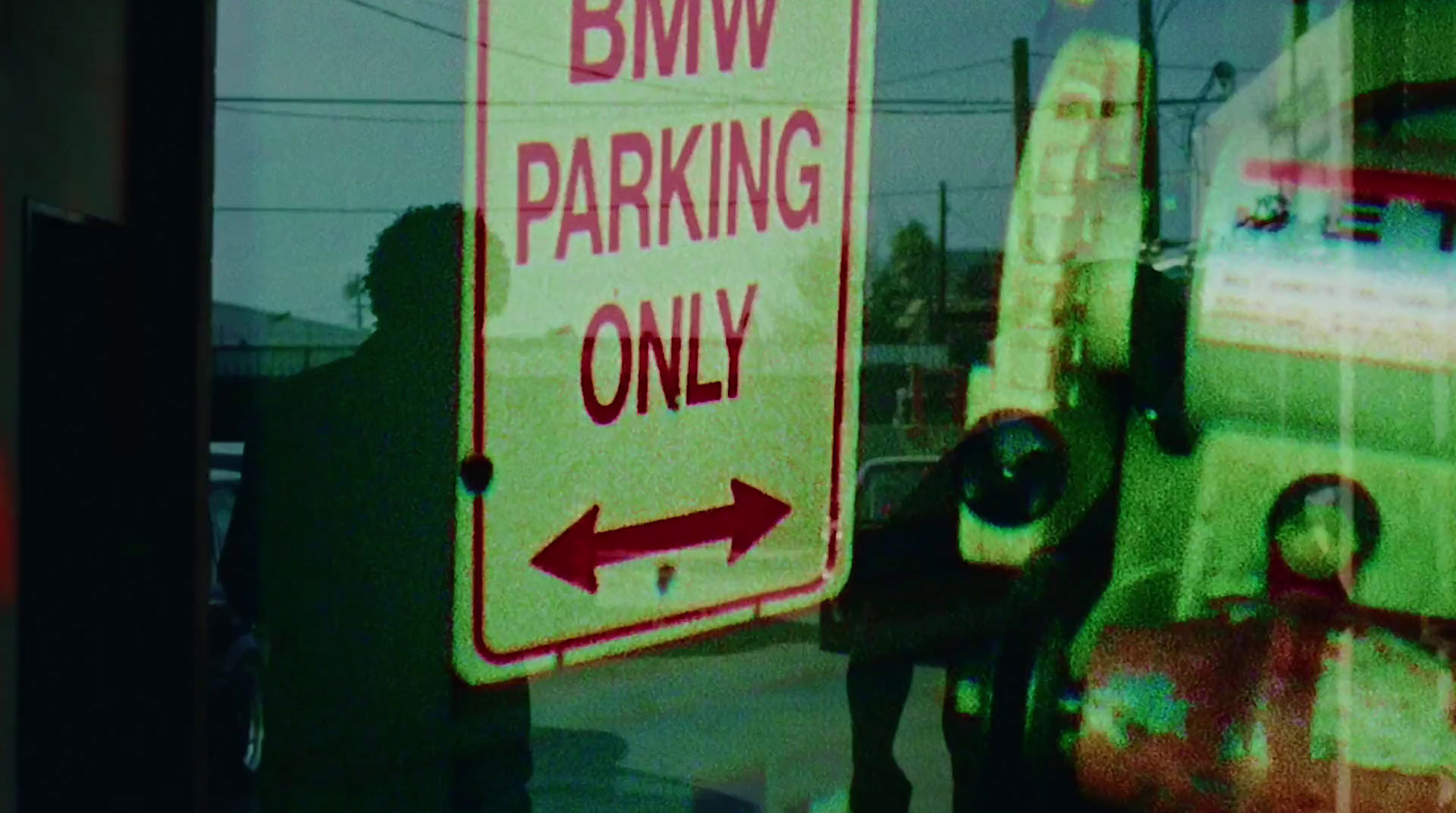 a red and white street sign sitting on the side of a road