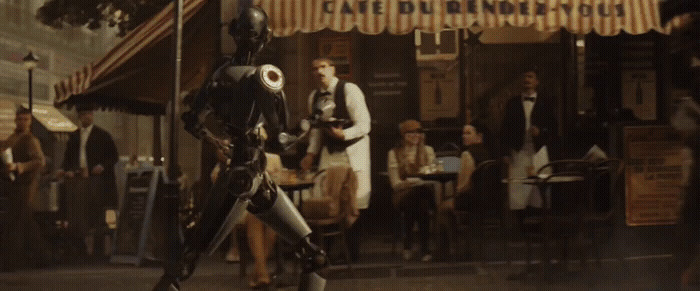 a man dressed as a robot walking down a street