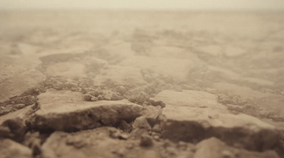 a black and white photo of rocks and dirt