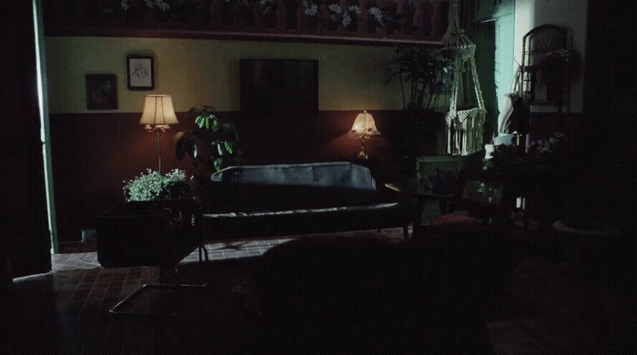 a living room with a couch and two lamps