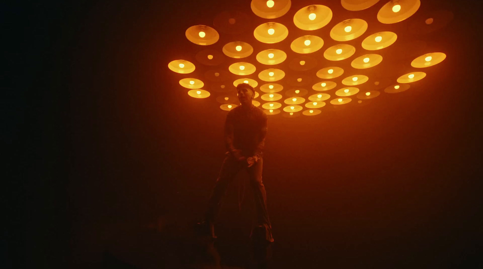 a woman standing in front of a bunch of lights