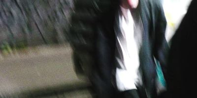 a blurry photo of a man in a suit and tie