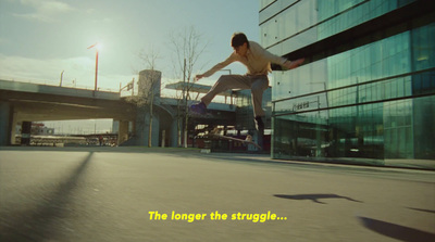 a man riding a skateboard down the side of a road