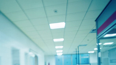 a long hallway with a clock on the wall