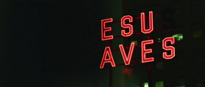 a red neon sign that says esu aves