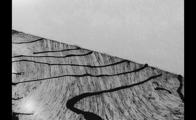 a black and white photo of a mountain slope