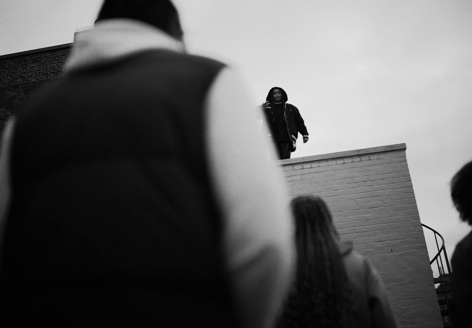 a black and white photo of a person on a skateboard