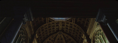 the ceiling of a large cathedral with a clock on it