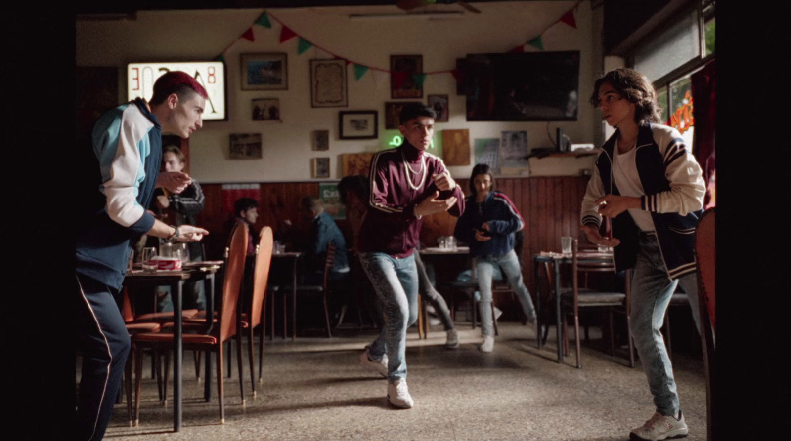 a group of young men playing a game with nintendo wii controllers