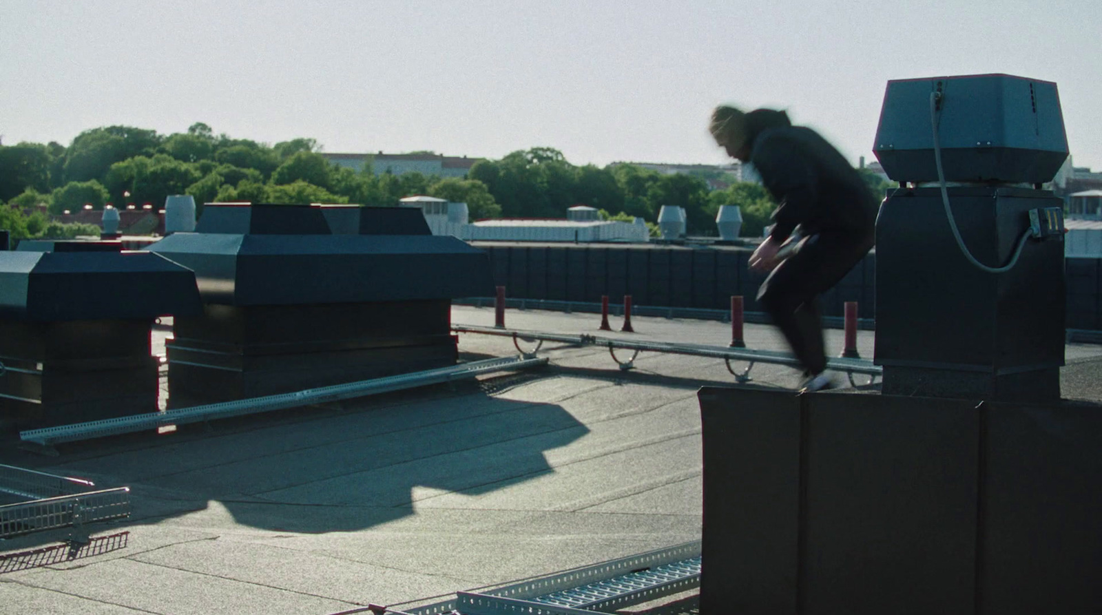 a person on a skateboard on top of a roof