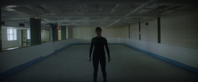 a person standing in an empty room in a building