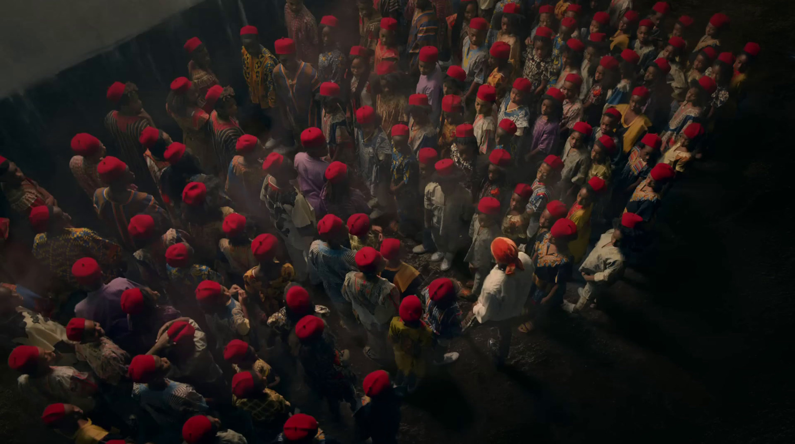 a large group of people with red hats