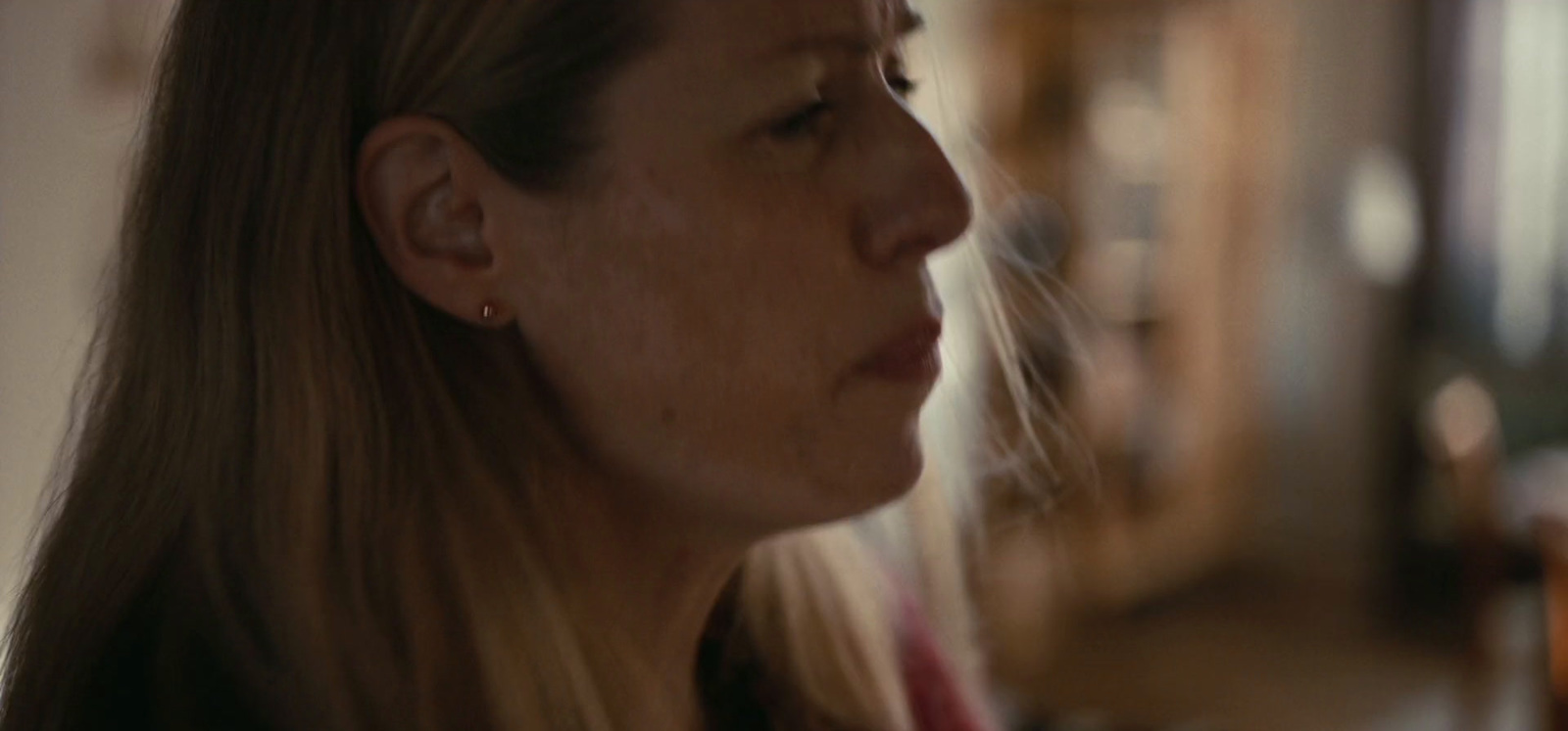 a close up of a woman with long hair