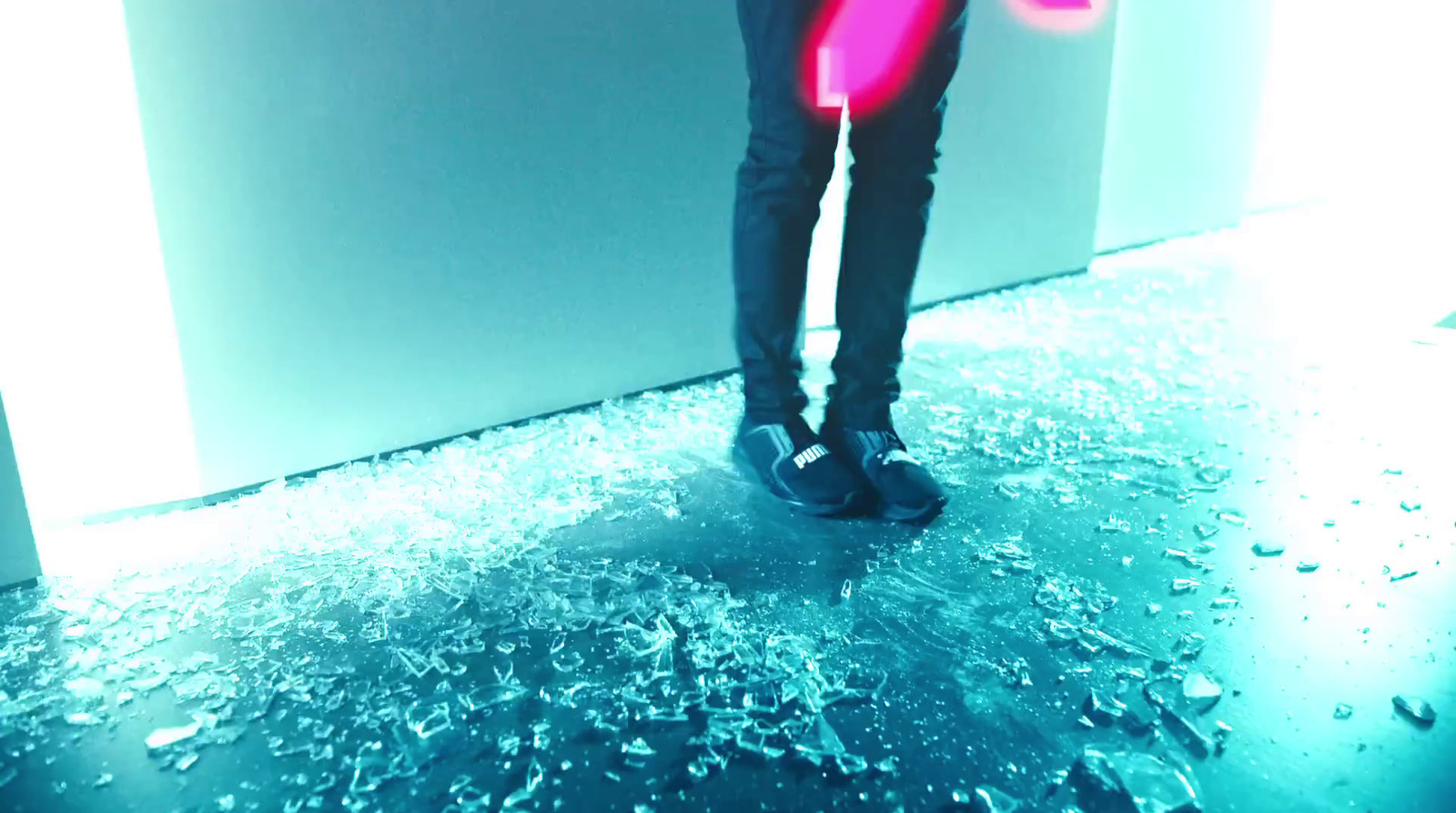 a person holding a pink frisbee in their hand