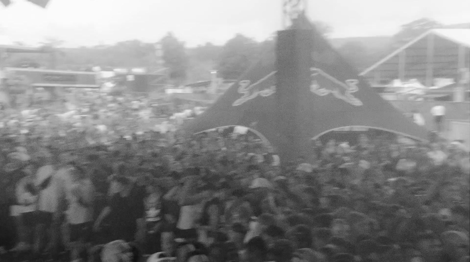 a large group of people standing around a boat