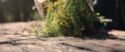 a pile of grass sitting on top of a wooden floor