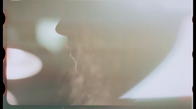 a blurry photo of a woman's face and hair