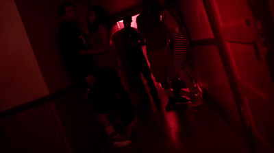 a group of people standing in a dark room