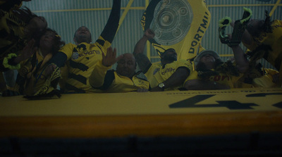 a group of soccer players sitting on a bench