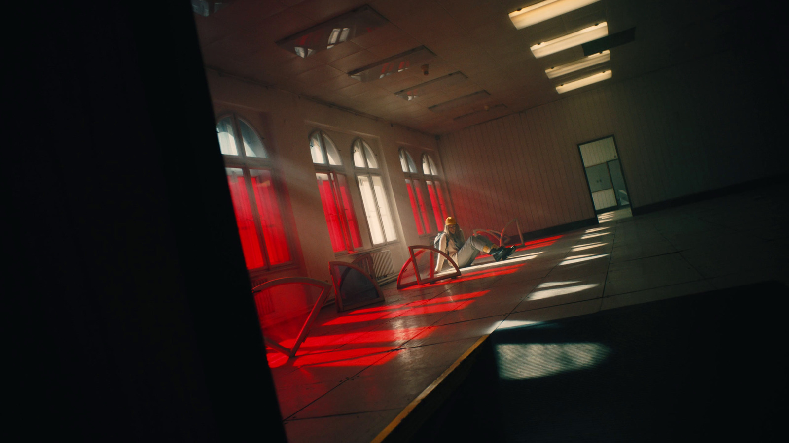 a person sitting on a chair in a large room