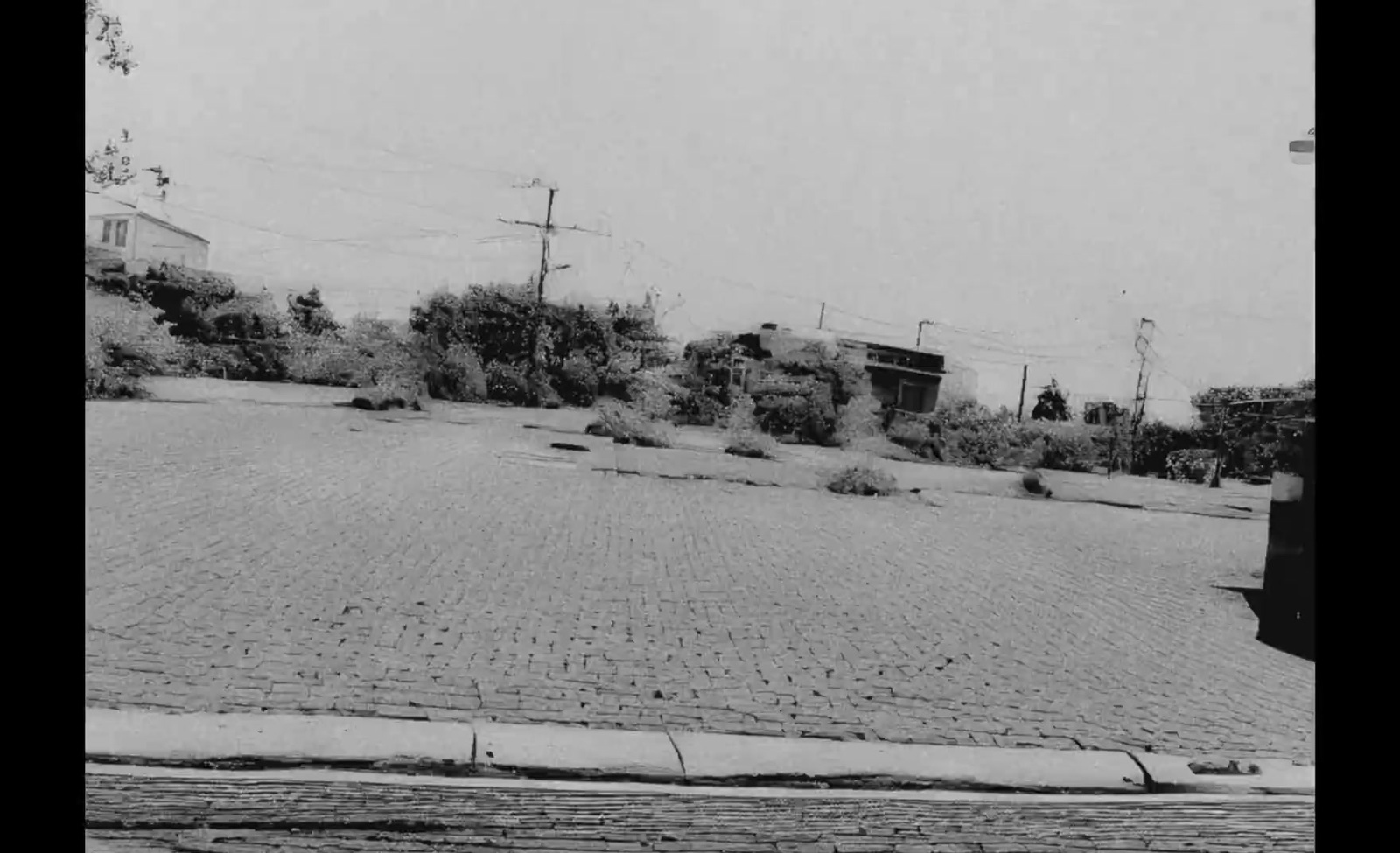 a black and white photo of an empty street