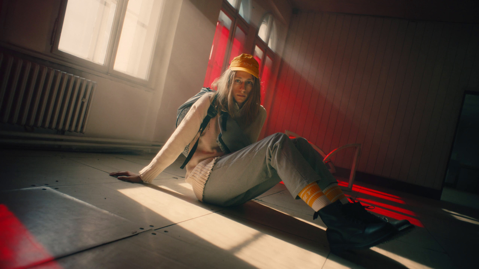 a woman sitting on the floor in a room