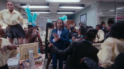 a group of people standing around a room