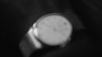 a black and white photo of a watch