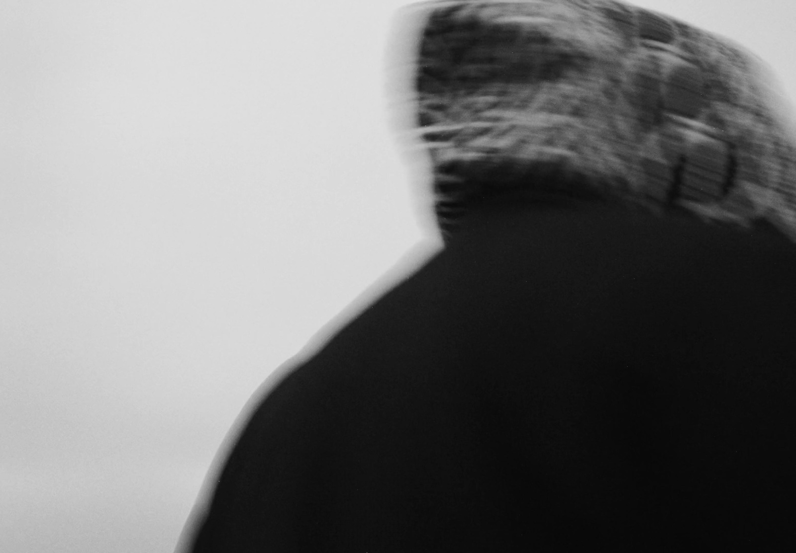 a black and white photo of a man's head