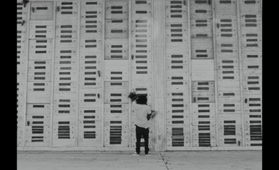 a person standing in front of a tall building