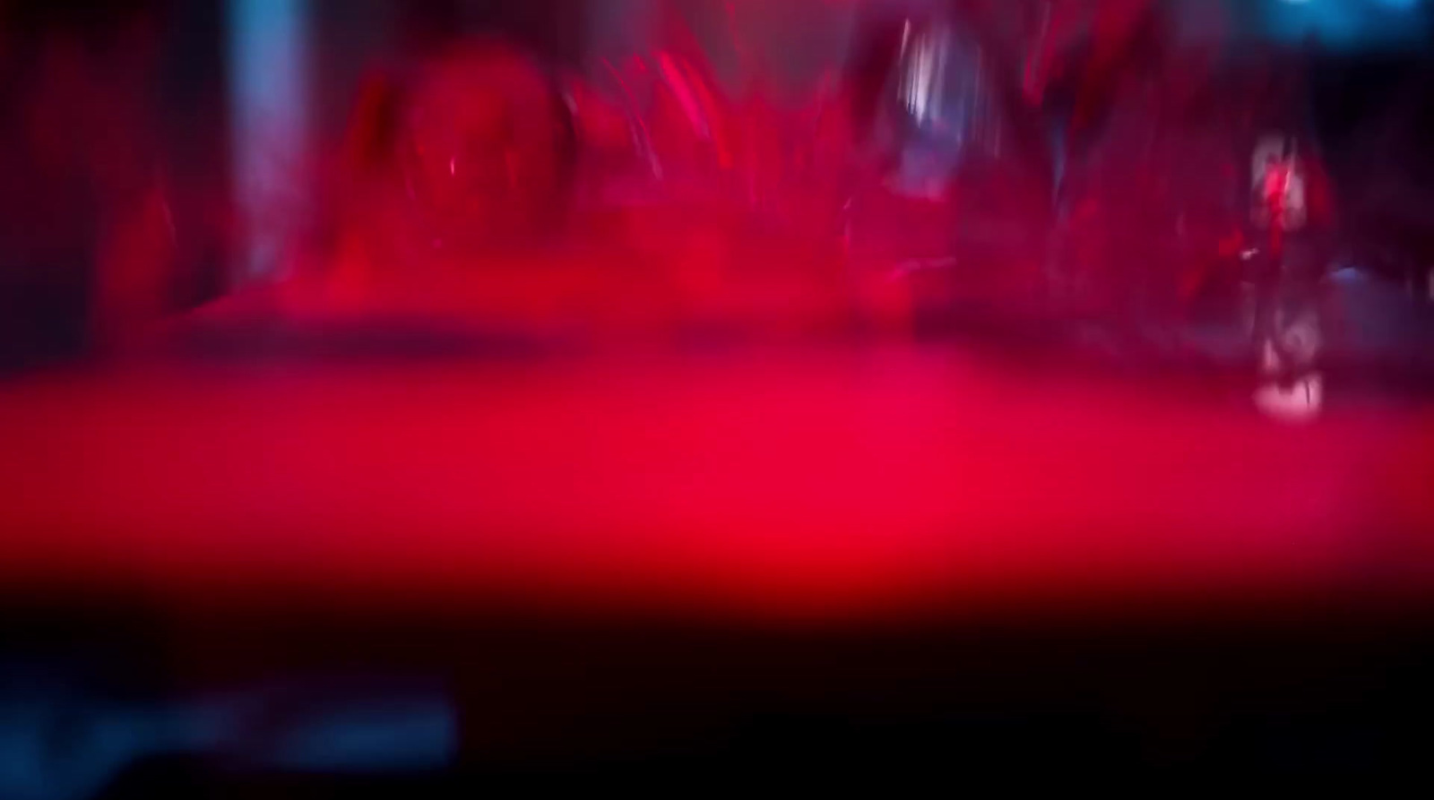 a blurry photo of a red table top