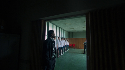 a group of men standing next to each other in a room