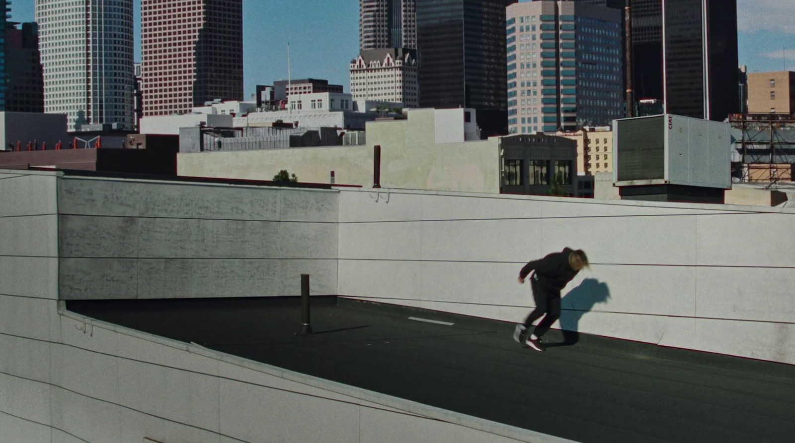 a man riding a skateboard down the side of a ramp