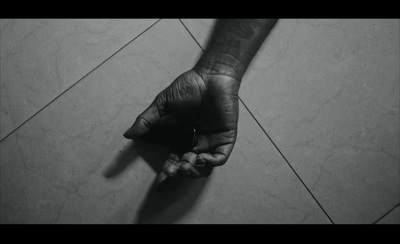 a black and white photo of a person's hand