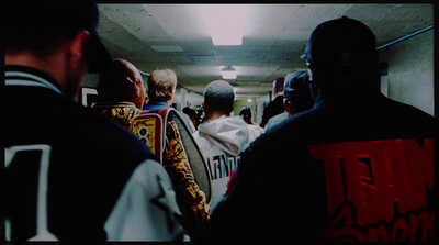 a group of people walking down a hallway