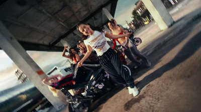 a group of people standing around a motorcycle