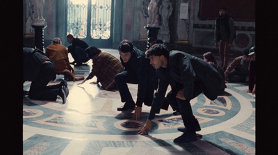 a group of people standing around a marble floor