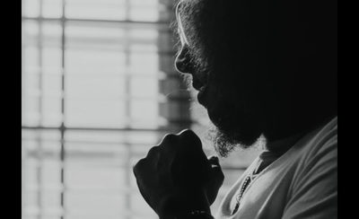 a black and white photo of a man with a beard