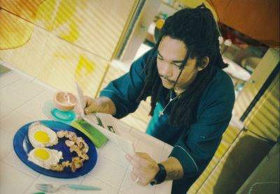 a man cutting up food on top of a blue plate