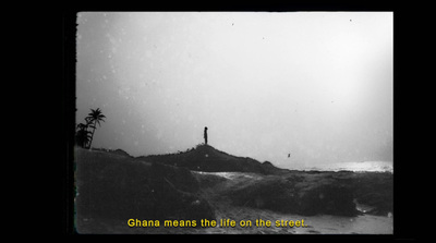 a black and white photo of a person standing on top of a hill