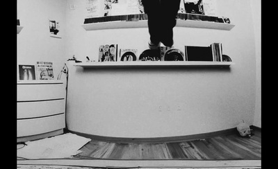 a man standing on top of a counter in a room