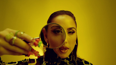 a woman looking through a magnifying glass