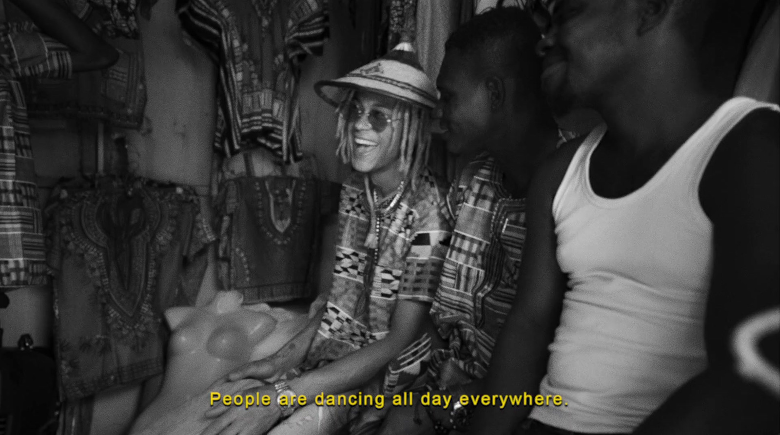 a group of people standing around each other